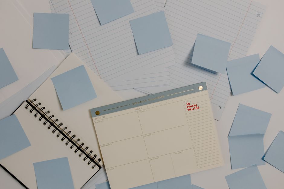 Desk with a planner and notes for organizing a repayment plan
